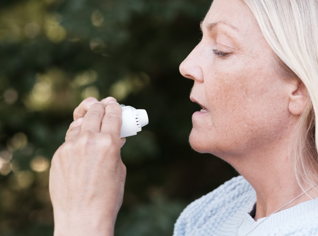 Home Remedies for COVID: How to Manage Symptoms at Home 1 A woman using an electric toothbrush to brush her teeth