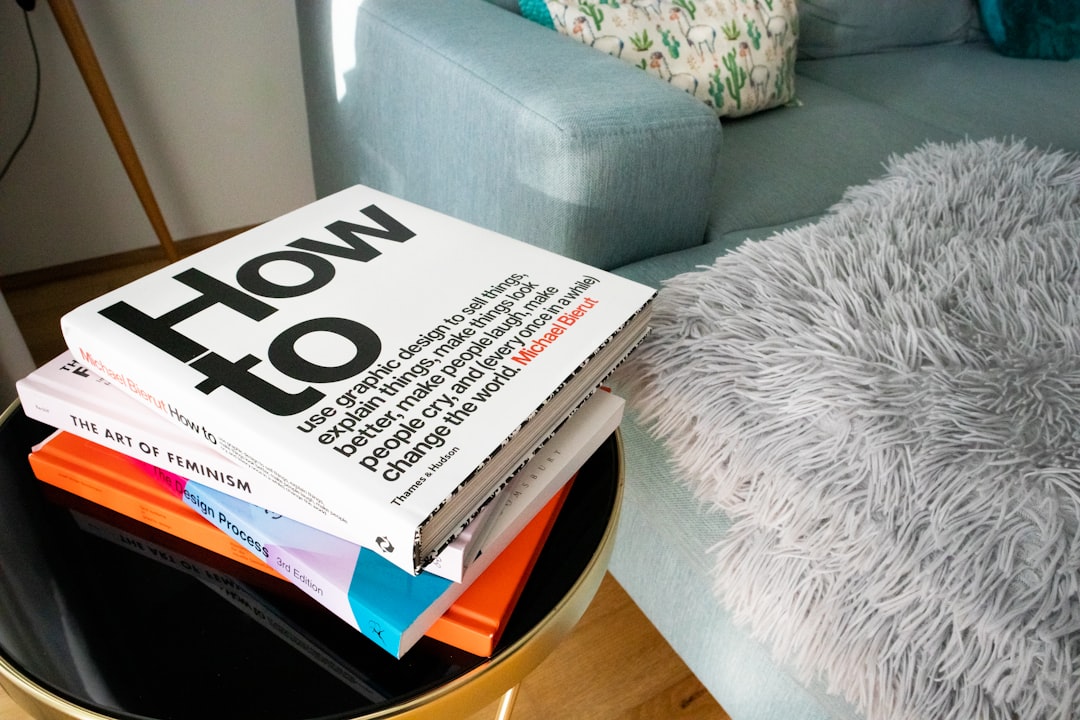 a stack of books sitting on top of a table