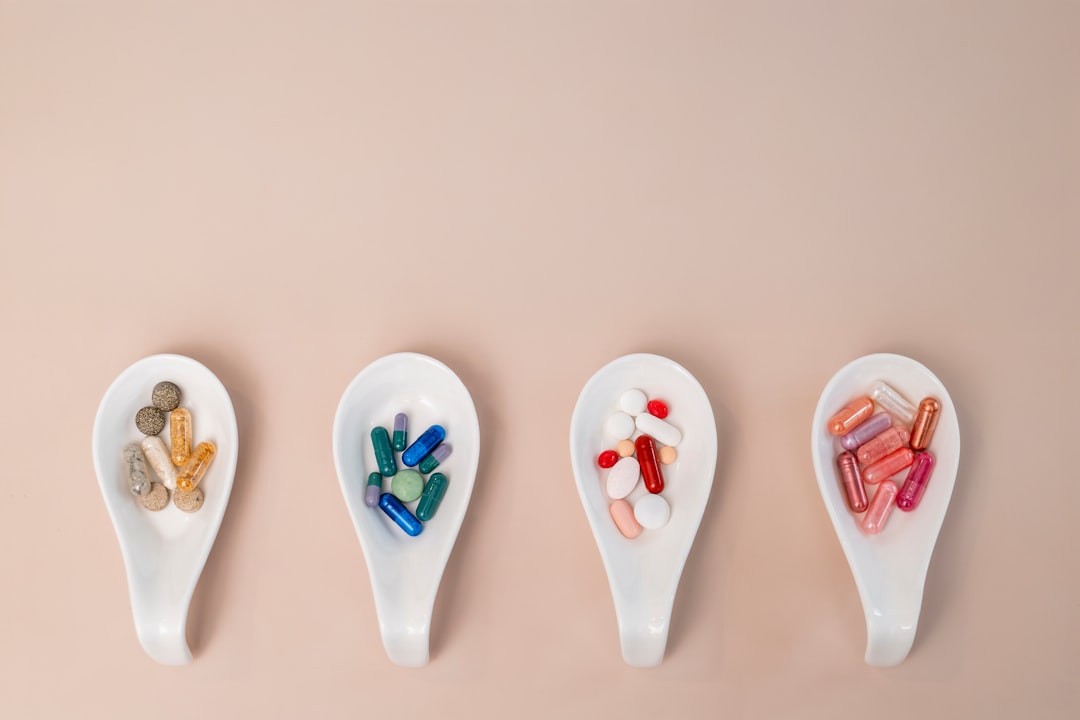 Magnesium for Sleep: Glycinate and Other Forms 2 A row of spoons filled with different types of pills