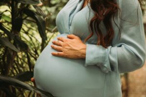 symptoms of pregnancy with iud